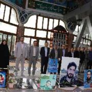 عطر افشانی مزار شهدا رشت توسط کارکنان بیمه سلامت